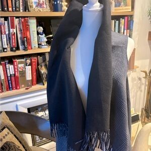 Vest/poncho. Sleeveless with fringe and ability to wrap around your neck.